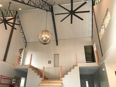 “The ultimate goal was to build a unique home with 28 ft high ceilings. We chose to leave the trusses exposed for the trendy industrial design style and we love it!” Barndominium Designs, Steel Homes, Exposed Trusses, Industrial Design Style, Steel Trusses, Customer Journey, Lake House Plans, Residential Construction, Construction Industry