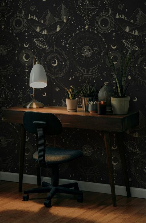 A study space featuring a dark celestial-themed witchy wallpaper with planets and stars, paired with a wooden desk and cozy autumn lighting. Black Bedroom Design Decorating Ideas, Accent Wall Wallpaper Bedroom, Wallpaper In Cabinets, Cozy Study Space, Mystical Room, Cosmic Wallpaper, Moon Mural, Cosmic Symbols, Cozy Study