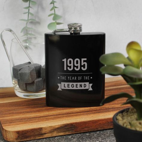 Black Metal 7oz Hip Flask, Engraved "1995 Year of The Legend", 30th Birthday Gifts for Men Him, 350ml, Thirtieth Gift for Boyfriend, Husband Is someone special in your life turning 30? This sophisticated black metal hip flask is a timeless and elegant gift, designed to celebrate a milestone occasion in style.  Engraved with the phrase "1995 : Year of the Legend," it pays tribute to an extraordinary milestone and the remarkable individual being honoured.  With dimensions of 9 x 13 x 2.2 cm and a capacity of 200ml, this flask is the perfect size for carrying a favourite beverage discreetly and conveniently. Its sleek black finish adds a touch of modern sophistication, while the durable metal construction ensures it is built to last.  The carefully engraved text enhances its charm, making it