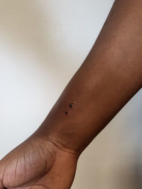 Small Tattoos For Black Women Skin, Wrist Tattoos For Women Small Semi Colon, Semi-colon Tattoo Dainty, Semi-colon Tattoo Minimalist, Semi-colon Tattoo Black Women, Small Tattoos On Black Women, Small Tattoo Black Women, Semi-colon Tattoo Ideas Wrist, Subtle Semi-colon Tattoo Ideas