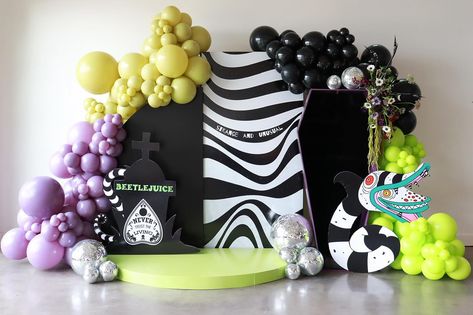 🎈 Bring the Beetlejuice Vibe to Life! 🎈 Add some spooky fun to your event with Beetlejuice-themed balloon decor! Here are quick ideas: Color Scheme: Use bold purples, greens, and black and white stripes. Balloon Arches: Create a striking entrance with a colorful balloon arch. Centerpieces: Cluster balloons on tables and add fun props like mini pumpkins or spooky figures. Photo Booth: Set up a fun photo area with balloon backdrops for memorable snaps. Ready to create a whimsical Beetlejuice ... Beetlejuice Photo Booth, Beetlejuice Backdrop, Colourful Balloons, Balloon Backdrop, Balloon Columns, Mini Pumpkins, Balloon Arch, Beetlejuice, Balloon Decorations