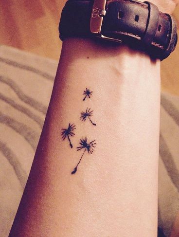 Dandelion tattoos signify energy, blossom, bravery, victory, joy, oracles, faithfulness, and spirituality when assembled with any color for making a design. Dandelion Tattoo Design, Flower Wrist Tattoos, Dandelion Tattoo, Cat Tattoos, Small Wrist Tattoos, Tiny Tattoo, Wrist Tattoos For Women, Subtle Tattoos, Tattoo Trends