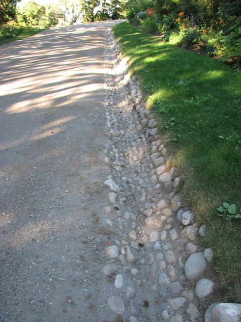 Stone lined drainage ditch Culvert Ideas Driveways Drainage Ditch, Stone Drainage Ideas, Rock Drainage, Downspout Drainage, Landscape Drainage, Backyard Drainage, Drainage Ditch, Yard Drainage, Drainage Solutions