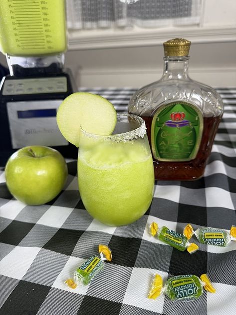 Boozy Frozen Drink Recipes for Summer | Crown Royal Apple Jolly Rancher Slush Washington Apple Drink Crown Royal, Sour Apple Crown Royal, Sour Apple Crown Slushy, Casamigos Drink Recipes, Crown Royal Drinks Recipes Easy, Crown Royal Recipes Drinks, Drinks With Apple Crown Royal, Green Apple Crown Royal Drinks, Sour Apple Cocktails