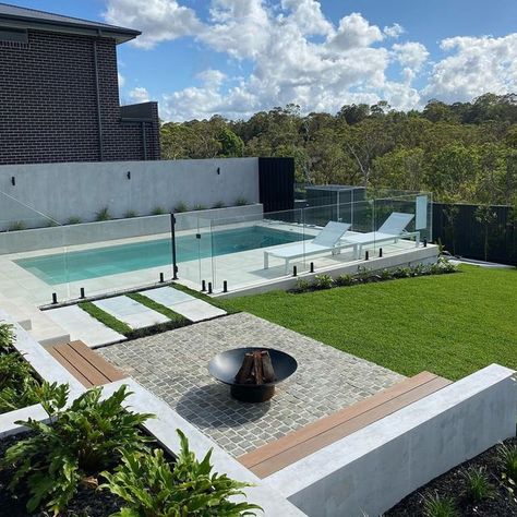 Outdoor Designer Store on Instagram: "Weekend Reset ✨...​​​​​​​​ ​​​​​​​​ Lazing by the pool in this backyard retreat is set to balance and nourish your mind, body & soul.​​​​​​​​ ​​​​​​​​ Designated fire pit area is fantastic feature in creating a focal point and a place for people to gather around and connect. ​​​​​​​​ .​​​​​​​​ Landscaping by @fcglandscaping" Backyard Pool Fire Pit, Plunge Pool And Fire Pit, Fire Pit Pool Area, Fire Pit Near Pool Area, Small Pool Landscaping Ideas, Pool Outdoor Area, Backyard Pool And Fire Pit Ideas, Pool And Fire Pit Ideas Backyards, Pool With Fire Pit Area