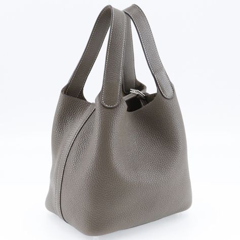 HERMES Picotan Rock 18 PM Handbag Taurillon Clemence Etoupe Made in France 2018 C Open Women'sGeneral Brand : Hermes Line : Picotin Country of Origin : France Design Type : Handbag Material : Taurillon clemence leather Color : Etoupe gray Closure : Open Gender : Women Size Size (HxWxD) : 18cm x 18cm x 13cm / 7.08'' x 7.08'' x 5.11'' Weight : 420g / 14.81oz. Handle Drop : 13.00cm / 5.12'' Inventory Serial Number : C Production Year : 2018 Included Items Accessories : Dust bag, Key, Padlock Accessories Notice : Before purchasing, please refer to the images of the accessories included with the item. Condition Condition : Used (very good) Ranking : Rank A Used - A few traces of usage, some scratches / dirt can be seen but overall in very good condition Seller Ranking : Rank A Overall Scratches France Design, Made In France, Dust Bag, Womens Sizes, France, Leather, Handbags, Color, Design