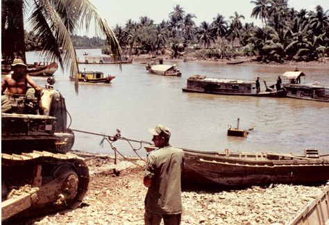 Dinh Tuong 1972 - Cho Gao Canal | Notice Road Grader which had fallen off raft into the canal. The canal was hand dug by slave labor under the French. 70s Vietnam, Animal Knowledge, Brown Water Navy, Black Berets, Pt Boat, Brown Water, Vietnam History, Photo Landscape, Agent Orange