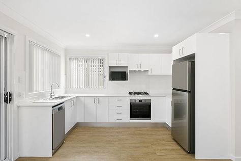 Lovely Granny Flat Kitchen featuring polyurethane cabinetry, dishwasher and microwave, gooseneck sink mixer and timber-look vinyl flooring by Granny Flat Solutions. Call us today on 9481 7443 to personalise yours! Granny Flat Kitchen, Flat Kitchen, Flatpack Kitchen, Granny Flats, Granny Flat, Flat Design, Vinyl Flooring, Design Project, Kitchen Ideas