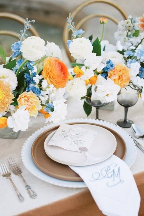 Blue Orange Tablescape, Orange Blue Centerpiece, Blue White And Orange Tablescape, Pink Blue And Yellow Party Decor, Blue Orange And White Centerpieces, Blue And Orange Flowers Wedding, Orange And Blue Tablescape, Green Orange Blue Wedding, Orange And Blue Table Setting