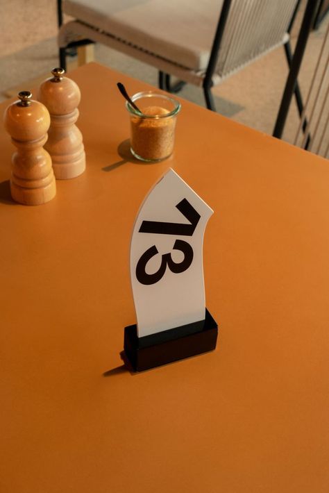 Yukiko – Camper – Cafe Camaleon in 2022 | Hospitality design, Cafe, Design Table Numbers Restaurant, Cafe Signage Design, Interior Signage, Restaurant Signage, Table Signage, Drukarka 3d, Environmental Graphic Design, Wayfinding Signage, Restaurant Branding