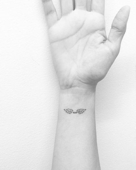 Wings 11.11 Angel Wing Wrist Tattoo, Wing Tattoos On Wrist, Wörter Tattoos, Remembrance Tattoos, Angel Wings Tattoo, Angel Tattoo Designs, Initial Tattoo, Small Wrist Tattoos, Dad Tattoos