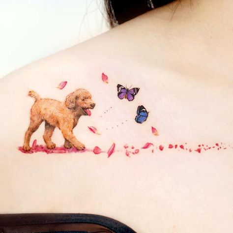 Dog and butterflies collarbone tattoo by @tilda_tattoo Dog With Fairy Wings Tattoo, Dog Butterfly Tattoo, California Dogface Butterfly Tattoo, Butterfly Dog Tattoo, Dog And Butterfly Drawing, Butterfly With Flowers Tattoo, Blue Butterfly Tattoo, Think Tattoo, Dog Memorial Tattoos