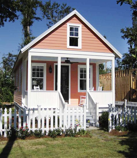 This compact two-bedroom tiny house has a living area and a charming little porch big enough for several rocking chairs. Katrina Cottage, Small House Pictures, Design Casa Piccola, Cute Small Houses, Buy A Tiny House, Tiny Cottages, A Small House, Tiny Cottage, White Picket Fence