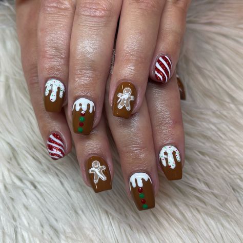 Super cute gingerbread man cookie nails with candy cane stripes. Perfect for fun Christmas nails Xmas Nails Gingerbread Man, Ginger Bread Man Nail, Gingerbread Christmas Nails, Gingerbread House Nails, Christmas Nails Gingerbread Man Pink, Disney Christmas Nails Gingerbread, Gingerbread Man Nails, Christmas Nails Gingerbread, Cookie Nails