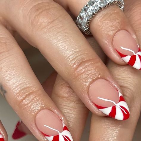 Patty 🤍 MIAMI NAIL ARTIST on Instagram: "candy cane frenchies 🍬🧑‍🎄 . Inspo from Pinterest . Used @nailzkatkat Rose Quartz French Tips white Use code “PBP10” for $$ off 🤍 . #nails #nailart #nailinspo #naildesign #candycane #christmas #red #frenchies #frenchtips #almond #apres #gelx #gelextensions #miami #miamigardens #miamilakes #hualeah #wynwood #doral #miramar #nailartist #nailtech" Peppermint Tip Nails, Winter Nails Candy Cane, Candy Cane Short Nails, Candy Cane Tip Nails, Candy Cane Nails Square, French Dip Christmas Nails, Candy Cane French Nails, Red And White Candy Cane Nails, Candy Cane Nail Ideas