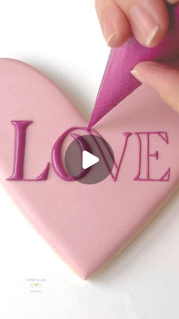 Honey & Lou Baking | Eileen on Instagram: "Sending this small dose of LOVE out into the world on another dark and chilly Winter evening. Who’s ready for Spring?! 🙋🏻‍♀️ Royal icing tutorial, tips and tricks, Valentine, Valentine’s Day, heart, lettering, pink love, decorating sugar cookies, holiday art #RoyalIcing #DecoratedCookies #CookieArt #heartcookie #rosecookie #valentinecookie #decoratingtips #decoratingtricks #RoyalIcingTips #royalicingtricks #buzzfeedtasty #CreativeBaking #CookieDesign #HandDecorated #EdibleArt #CookieInspo #InstaCookies #CookieVideo #howtodecoratecookies #satisfyingvideos #cookielover #cookiegram #cookiesofinstagram #thebakefeed #designercookies #cookiedecorator #cookieartist #sugarcookiedecorating #sugarcookies #sugarcookiesofinstagram" Royal Icing Lettering, Royal Icing Tutorial, Heart Cookies Decorated, Heart Lettering, Decorating Sugar Cookies, Cookie Gram, Valentine Cookies Decorated, Heart Sugar Cookie, Cookies Holiday