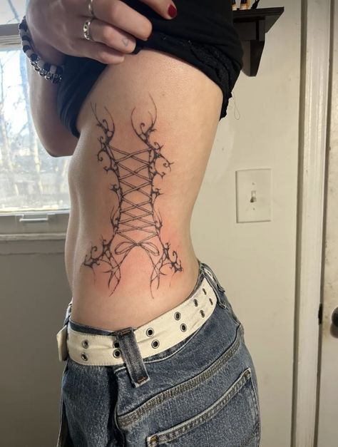 abstract tattoo lace up tattoo Misfits Tattoo, Corset Tattoo, Cute Tats, Wicked Tattoos, Stomach Tattoos, Black Tattoo, Side Tattoos, Wings Tattoo, Baby Tattoos