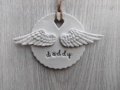 A gorgeous hanging decoration stamped with your choice of wording and adorned with a pair of angel wings. (Please note the font used does not contain capital letters, any names/words will be in lower case) Each piece is made from a white air drying clay and hung using a natural twine. All of my items are lovingly hand made so each one is individual and personal to you, please send a message with your order to specify the details the wording you would like. This will make a beautiful addition to Air Dry Clay Angel Wings, Polymer Clay Angel Wings, Clay Angel Wings, Angel Clay, Christmas Tree Feathers, Clay Angels, Clay Angel, Air Drying Clay, Christmas Decoration Items