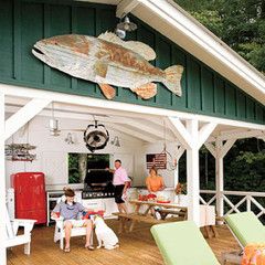 Galvanized Metal Lights Complete Lakeside Cabin Makeover | Barn Light Electric Lake House Deck, Southern Living Rooms, Cabin Makeover, Sitting On The Porch, Cottage Outdoor, Lakeside Cabin, Lakeside Living, River Cabin, Lake Houses