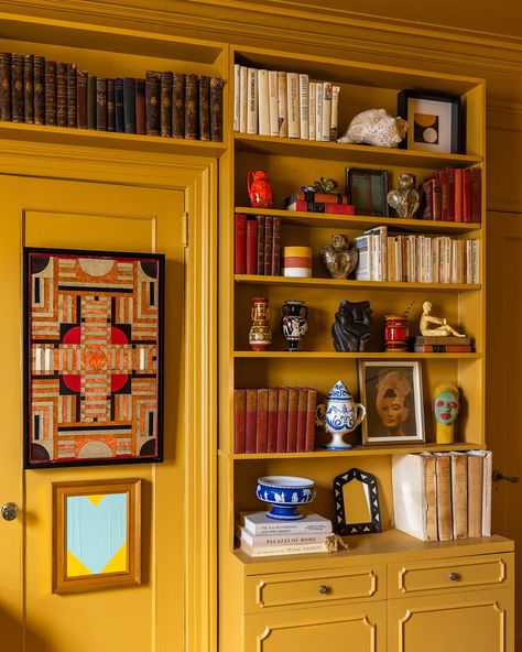 Books organized on yellow painted bookshelf. Yellow Library, Yellow Bookshelves, Palace In The Sky, Painted Bookshelf, Modern Barn Style, Indian Festival Of Lights, Bookshelf Inspo, Upper East Side Apartment, Pursuit Of Knowledge