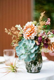 Succulents provide a unique alternative to the typical floral arrangement! #rusticweddings #weddingdecor Dahlia Centerpiece Wedding, Succulents Wedding Flowers, Succulent Wedding Decor, Succulent Wedding Centerpieces, Dahlias Wedding, Garden Centerpiece, Simple Wedding Centerpieces, Succulent Bouquet, Succulent Centerpieces