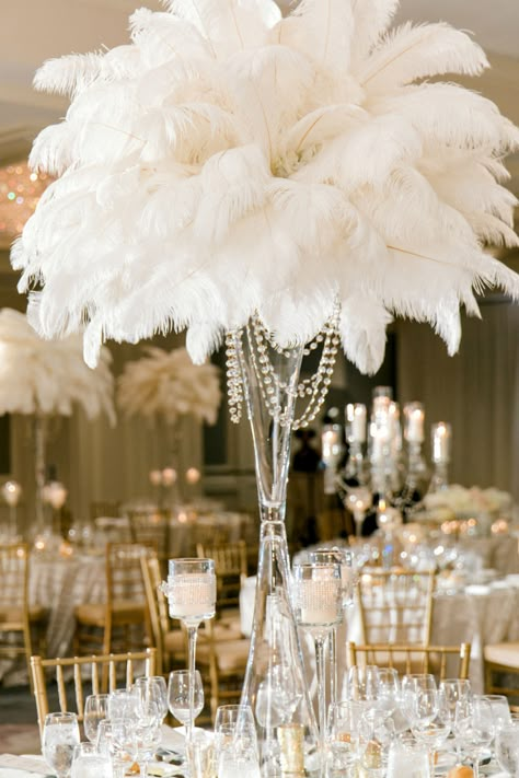 Tall glamorous wedding centerpiece of white ostrich feathers and draping crystals designed by Edge Design Group. Feather Wedding Centerpieces, 20s Wedding Theme, 1920s Prom, Feather Centerpiece Wedding, Gatsby Wedding Decorations, Feather Wedding Decorations, Gatsby Glam, Angel Wedding, Ostrich Feather Centerpieces