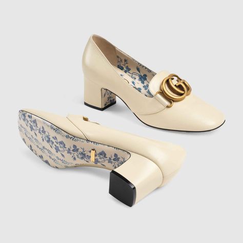 Shop the Leather mid-heel pump with Double G by Gucci. A journey through different decades in costume history, the Pre-Fall 2018 shoe collection brings back a high-tongued buckled shape that dates back to the Pilgrims' days, in XVII century America, and became very popular by the end of the '60s and the early '70s. Reinterpreted the Gucci way, the mid-heel pumps are enhanced by the emblematic Double G, a historical code taken from the archives. Inspired by a delicate pattern first displayed on r 60s Shoes, Gucci Heels, Gucci Loafers, Mid Heels Pumps, Fancy Shoes, Women Shoes Online, Aesthetic Shoes, Shoes Heels Pumps, Heels Pumps