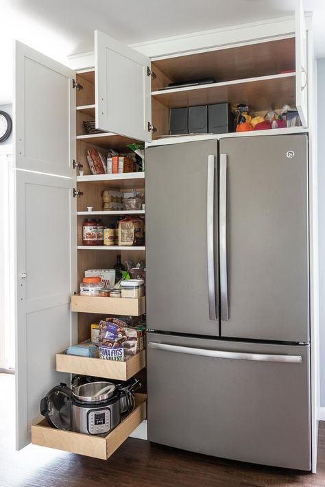 One of my favorite parts of our kitchen remodel is this fridge enclosure. The pull-out shelves for the pantry are a must-have.  If I had it to do over, I would have added a 4th pullout.  The deep cabinet above the fridge provided much-needed additional storage for our small home.  For more photos of this remodel, visit the blog. Refrigerator Cabinet, Kabinet Dapur, Kitchen Pantry Design, Kitchen Pantry Cabinets, Kitchen Room Design, Pantry Design, Pantry Cabinet, Kitchen Redo, Kitchen Cabinet Design