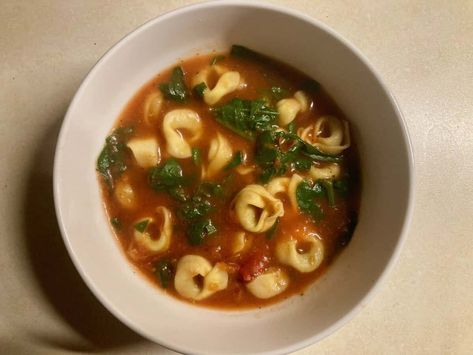 This cozy soup is a simple and satisfying. The recipe is from one of my favorite Weight Loss Success Stories, cookbook writer Pam Anderson and her wonderful book, The Perfect Recipe for Losing Weight and Eating Great. It combines pantry staples like crushed tomatoes, chicken broth, and Italian seasoning with dried tortellini and fresh spinach for a comforting, hearty meal. Quick to prepare and packed with flavor. #soup #quick #easy #WW #weightwatchers #points #healthy #recipe #tomato #tortellini Ww Tortellini Soup, Easy Homemade Soups, Tomato Tortellini, Soup Quick, Spinach Tortellini Soup, Tomato Tortellini Soup, Recipe Tomato, Spinach Tortellini, Canning Crushed Tomatoes