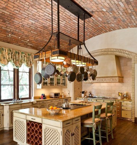 Pots and pans hanging over kitchen island. Love brick ceiling. Rustic Italian Decor, Pot Rack Kitchen, Pan Hanger, Vaulted Ceiling Kitchen, Diy Storage Rack, Hanging Pans, Mediterranean Kitchen, Pot Rack Hanging, Brick Kitchen