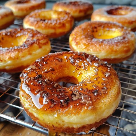 🍩✨ Indulge in the ultimate breakfast delight with Heavenly Crème Brûlée Donuts! #CremeBruleeDonuts #GourmetDonuts 🍽️ Heavenly Crème Brûlée Donuts 🛒 Ingredients: 500 grams all-purpose flour 10 grams instant yeast 50 grams sugar 5 grams salt 250 ml warm milk 2 large eggs (about 100 grams) 50 grams unsalted butter, softened 200 grams vanilla pastry cream 100 grams granulated sugar (for caramelizing) 👩‍🍳 Instructions: Dough Preparation: Mix flour, yeast, sugar, and salt. Add warm milk and egg... Cream Donut Recipe, Donut Sprinkle, Vanilla Pastry Cream, Fried Donuts, Instagram Recipes, Cookie Bakery, Ultimate Breakfast, Twisted Recipes, Dessert Tea