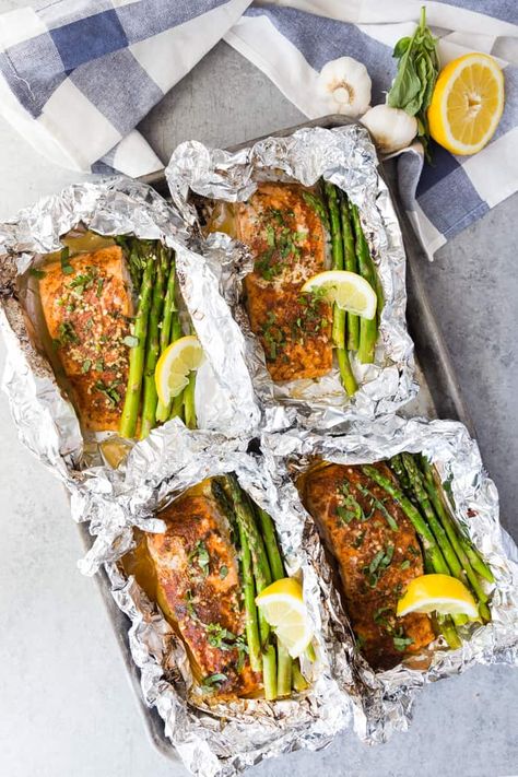 Asparagus Salmon Foil Packets are filled with tender and flaky salmon with fresh asparagus all cooked in an herb butter sauce, on one sheet pan, wrapped in foil, making this the ultimate meal. #spendwithpennies #foilpackets #easyrecipe #salmonrecipe #cookingfish #easybake #lemonasparagus #simpletinfoil #healthybake #salmonfoilpacket #asparagussalmon Salmon Asparagus Foil, Herb Butter Sauce, Salmon Foil Packets, Spring Recipes Dinner, Salmon In Foil, Foil Packet Meals, Salmon And Asparagus, Healthy Salmon, Easy Salmon