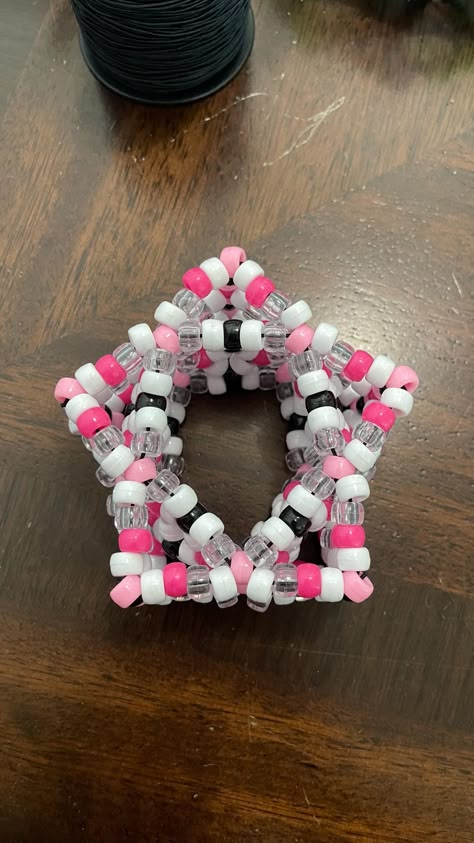 Star Kandi Cuff. Pink, Black, White, and Clear. Scene Kandi Bracelets Ideas, Kandi Rotating Cuff Ideas, Kandi Glove, Kandi Star Cuff Tutorial, Kandi Flower Cuff, Kandi Star Cuff, Scenecore Kandi, Kandi Cuff Ideas, Hello Kitty Kandi Cuff