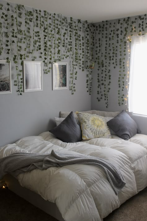 Aesthetic Room Decor For Couples, Greenery Bedroom Wall, Bed Inspo No Headboard, Lavender Rooms Bedrooms, Behind Bed Wall Decor Aesthetic, Bed Without Headboard Decor Ideas, Vine Fairy Lights Bedroom, How To Hang Vines In Bedroom Corner, Bed Frame No Headboard Ideas