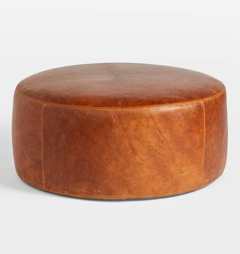 Britton Leather 36" Round Ottoman | Rejuvenation Round Leather Ottoman Coffee Table, Voodoo Room, Apartment Foyer, Hampton Living Room, Round Leather Ottoman, Leather Ottoman Coffee Table, Lauren Moore, Basement Den, Vintage Living Room Furniture