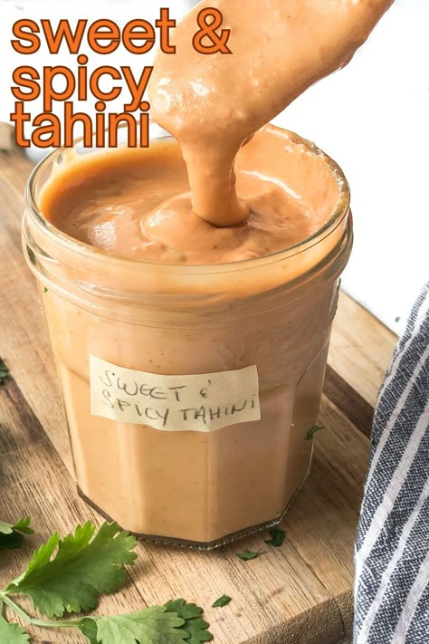 CURRENT SAUCE OBSESSION!!! This quick and easy tahini sauce recipe is the PERFECT balance of spicy, sweet, and umami flavors. It's outstanding on bowls, salads, tacos, sandwiches, burgers, burritos, and grilled veggies. You're going to LOVE it!!! #spicytahinisauce #tahinisauce Spicy Tahini Dressing, Vegan Dipping Sauce, Turmeric Sauce, Spicy Tahini Sauce, Resep Vegan, Sauce Burger, Tahini Sauce Recipe, Burger Bowls, Vegan Sauce Recipes