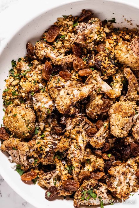 This blackened cauliflower is one of the best side dishes imaginable. The cauliflower is first roasted until golden and then topped with crispy herb and garlic panko and sweet, plump raisins. #theendlessmeal #cauliflower #sidedish #dinnerrecipes #cauliflowerrecipes #lowcarb #healthysidedish #fallsidedish #wintersidedish #vegetarian #blackenedcauliflower Blackened Cauliflower, Winter Side Dishes, Yummy Vegetable Recipes, Autumn Side Dishes, Crispy Garlic, Best Side Dishes, Sheet Pan Dinners, Cauliflower Recipes, Healthy Side Dishes