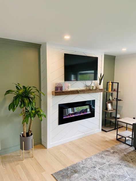 Our Shiplap fireplace with evergreen fog walls Shiplap Herringbone Fireplace, White Fireplace Green Wall, Green Wall White Fireplace, Evergreen Fog Fireplace, Herringbone Shiplap Fireplace, Evergreen Fog Walls, Green Fireplace Wall, Vertical Shiplap Fireplace, Herringbone Fireplace