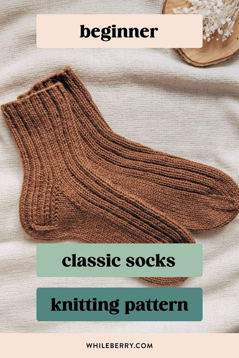 If you've always wanted to knit basic cozy socks, use this minimalist knitting pattern to knit your first simple sock pair! Using worsted weight yarn, they are super quick to knit and will be a great choice for gift knitting too. Find this beginner sock knitting pattern at whileberry.com Handknit Socks Free Pattern, Dk Weight Knitting Patterns Free, Ribbed Socks Knitting Pattern, Beginner Mitten Knitting Pattern, What To Knit For Beginners, Beginner Knit Socks Free Pattern, Easy Knitting Gifts, Knit Clothing Patterns, Quick Knitted Gifts