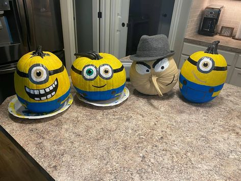 My son had a storybook pumpkin project, so we decided we would paint the whole Minion clan!💙💛 Minion Pumpkins Painting, Minion Pumpkin Painting, Minions Pumpkins Painting, Purple Minion Pumpkin Painting, Pumpkin Minions, Minon Pumpkin Painting, Purple Minion Pumpkin, Doodle Bob Pumpkin Painting, Minion Pumpkins