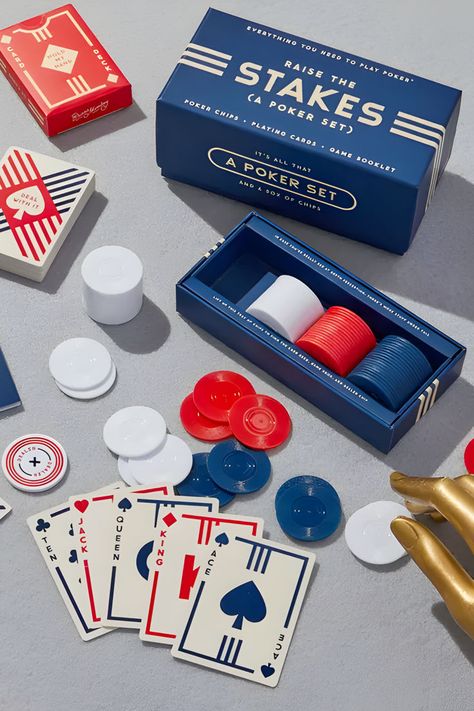 Get ready to up your poker game with this compact and stylish set. This poker set by Brass Monkey has everything you need to get uncomfortably competitive with your friends and family. Includes 100 poker chips (25 blue, 25 red, 50 white) & a dealer marker. Explore our Pinterest Board for more ideas and in-depth details on Marmalade. #GameIdeas #HolidayPartyGames #PartyActivities #FestiveFun #BoardGames #CardGames #TriviaGames #DrinkingGames Friendsgiving Games, Classic Card Games, Reunion Games, Brass Monkey, Poker Set, Poker Game, Holiday Party Games, Thanksgiving Games, Poker Games