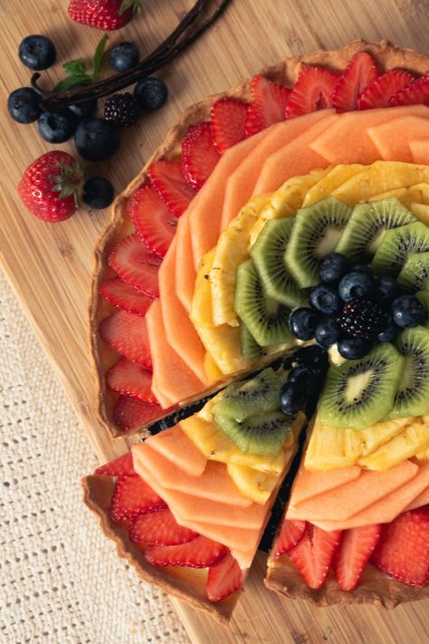 Image description: A rainbow fruit tart has a slice taken out of it. Pride Recipes, Rainbow Eating Recipes, Rainbow Fruit Tart, Eat Your Rainbow Healthy Food, Pride Month Baked Goods, Vegan Rainbow Salad, Rainbow Fruit, Yogurt Dip, Rainbow Food