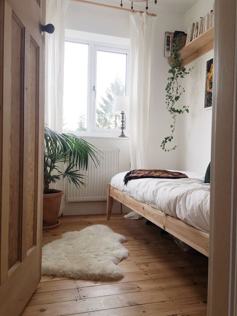 Day bed/ wooden floorboards/ sheepskin rug/ book shelves/ hanging plant Small Bedroom With Wooden Floor, Bedrooms With Floorboards, Wooden Day Bed, Floorboards Bedroom, Wooden Floorboards Bedroom, Wooden Bedframe Aesthetic, Bedroom Floorboards, Bedroom With Floorboards, Wooden Floors Bedroom