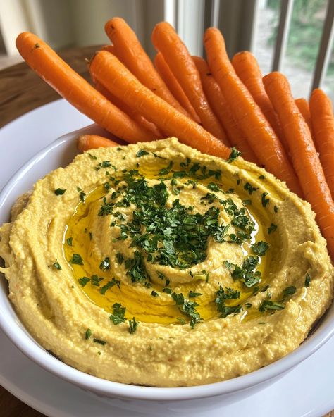 Everyone loves this simple hummus! It's quick to make and the kids can't get enough of those crunchy carrot sticks!  Ingredients: - 1 can of chickpeas - 2 tablespoons of tahini - 2 cloves of garlic  For the rest of the ingredients, check the link in the first comment [👇] [👇].   Enjoy your tasty, healthy snack!   #Hummus #HealthySnacks #EasyRecipes #CarrotSticks #QuickMeals Carrots And Hummus, Simple Hummus, Carrot Chips, Carrot Sticks, Tasty Healthy, Manifestation Board, What You Eat, Chickpeas, Tahini