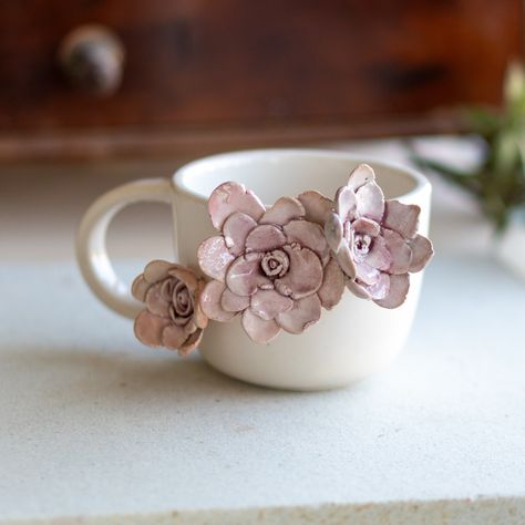 ✨ Unveiling a Masterpiece of Artisanal Craftsmanship: The Flower Ceramic Mug ✨ 🌸 Discover the Epitome of Elegance and Craft in Every Sip - The Handmade Floral Coffee Cup, a Valentine's Day Gift Par Excellence 🌹 A Symphony of Art and Utility: A Rose by Any Other Name... Step into a world where artistry meets daily life with our Flower Ceramic Mug. Each cup, a canvas of skilled artisans, showcases a meticulous fusion of beauty and functionality. The exquisite 3D flower appliques, not just painted but sculpturally brought to life, transform each sip into an experience. Imagine holding a blooming garden in your hands every morning - a reminder of nature's serenity amidst your busy day. 🌸 Unique in Every Way: Handcrafted, Hand-Painted, Unparalleled No two mugs are alike; each one is a testam Coffee Cup Pottery, Flower Ceramic Mug, Cozy Morning Coffee, Flower Cups, Mug Valentines Day, Eine Rose, Ceramic Rose, Cup Pottery, Ceramic Artwork