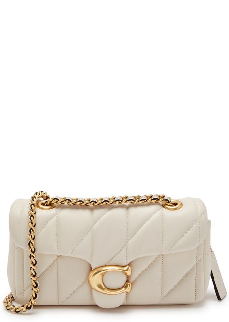 Find COACH Tabby 20 Quilted Leather Shoulder Bag on Editorialist. This Coach leather shoulder bag features two chain and leather shoulder straps, a quilted design, a designer plaque, a hanging designer tag, a back slip pocket, a concealed magnetic flap front pocket, two internal compartments, and a fully lined interior. It has a push-clasp fastening at the flap front. The bag measures 8 inches wide, 3.5 inches high, and 2.5 inches deep. The shoulder strap drop is 12 inches. Aesthetic Purses, Coach Tabby, Trendy Purses, Girly Bags, Coach Shoulder Bag, Chic Bags, Pretty Bags, Coach Accessories, Coach Leather