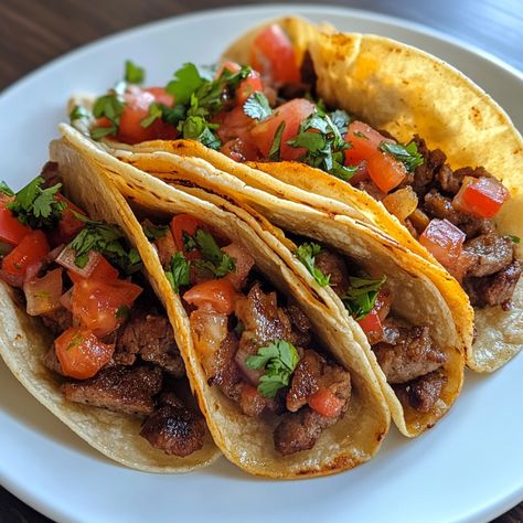 ### 🌮 ¡Deliciosos Tacos Mexicanos! 🇲🇽 **Ingredientes:** - 500 g de carne de res, cerdo o pollo, picada - 8 tortillas de maíz - 1 cebolla, picada - 1 tomate, picado - 1 aguacate, en rodajas - Cilantro fresco, al gusto - Limón, al gusto - Sal y pimienta al gusto - Salsa (de tu elección) **Instrucciones:** 1. En una sartén, cocina la carne a fuego medio hasta que esté dorada. Agrega sal y pimienta al gusto. 2. Calienta las tortillas en un comal o sartén durante unos segundos por cada lado. 3... Tacos Mexicanos, Minced Beef, Mexican Tacos, Corn Tortillas, Fresh Cilantro, Cooking Meat, Tortillas, Cilantro, Cooking And Baking