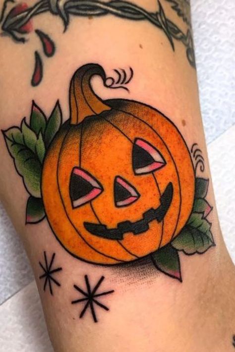 Halloween tattoos often include spooky and unconventional elements such as witches, ghosts, skeletons, pumpkins, bats, and black cats. These icons lend themselves to creative interpretations, creating visually striking and captivating tattoo designs. People are drawn to Halloween-themed tattoos' bold, intricate, and sometimes macabre aesthetics. Pumpkin Tattoos, Halloween Tattoo Flash, Halloween Tattoo Ideas, Tricep Tattoos, Lantern Tattoo, Pumpkin Tattoo, Autumn Tattoo, Inner Forearm Tattoo, Goth Tattoo