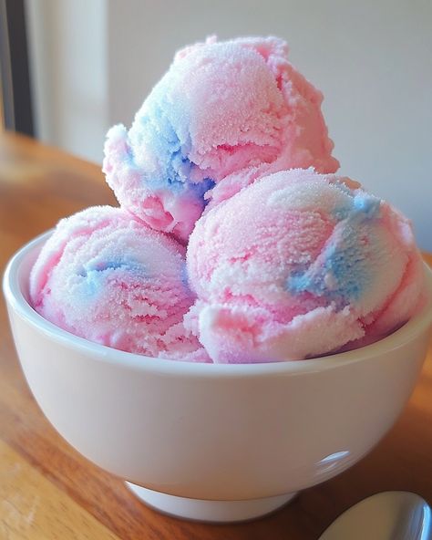 Cotton Candy Ice Cream 🍭🍦 Ingredients - 2 cups heavy cream - 1 cup whole milk - 3/4 cup granulated sugar - 1 teaspoon cotton candy extract - A few drops of pink food coloring (optional) - Cotton candy, for garnish Instructions 1. In a mixing bowl, whisk together heavy cream, whole milk, granulated sugar, cotton candy extract, and food coloring until the sugar is dissolved. 2. Pour the mixture into an ice cream maker and churn according to the manufacturer's instructions until it reaches a s... Cotton Candy Aesthetic, Aesthetic Ice Cream, Cotton Candy Ice Cream, Sherbet Ice Cream, Candy Ice Cream, Blue Cotton Candy, Pink Food, Yummy Ice Cream, Ice Cream Ingredients