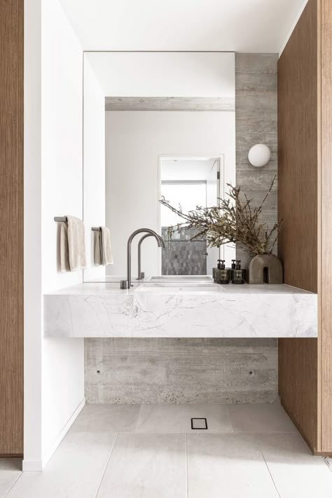 The Grotto: Brutalist Architecture Meets Biophilic Design in This Modern Masterpiece | (NZ) ABI Bathrooms & Interiors Gunmetal Tapware, Stone Bathrooms, Dolomite Stone, Build Office, Abi Interiors, Natural Stone Bathroom, Stone Vanity, Stone Mirror, The Grotto